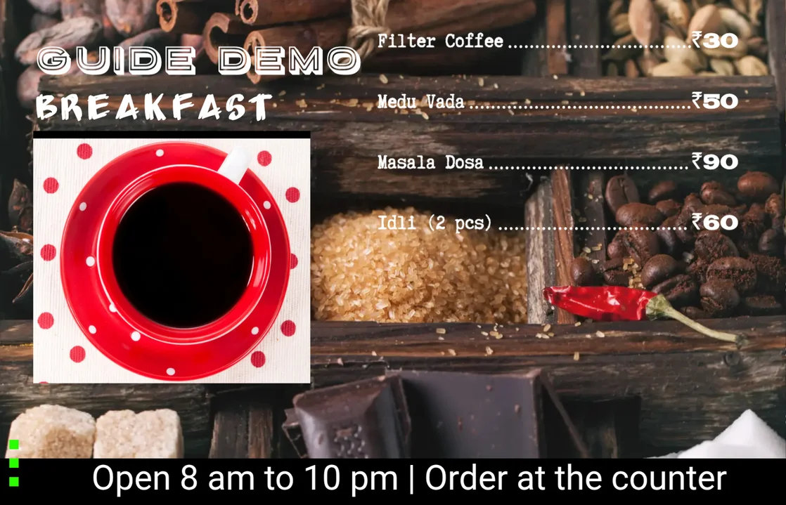The finished breakfast menu board on a TV with four South Indian dishes, rupee prices and a ticker reading Open 8 am to 10 pm, Order at the counter