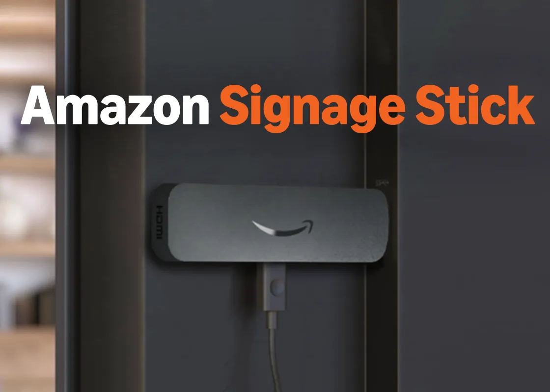 Amazon Signage Stick plugged into the HDMI port on the back of a screen